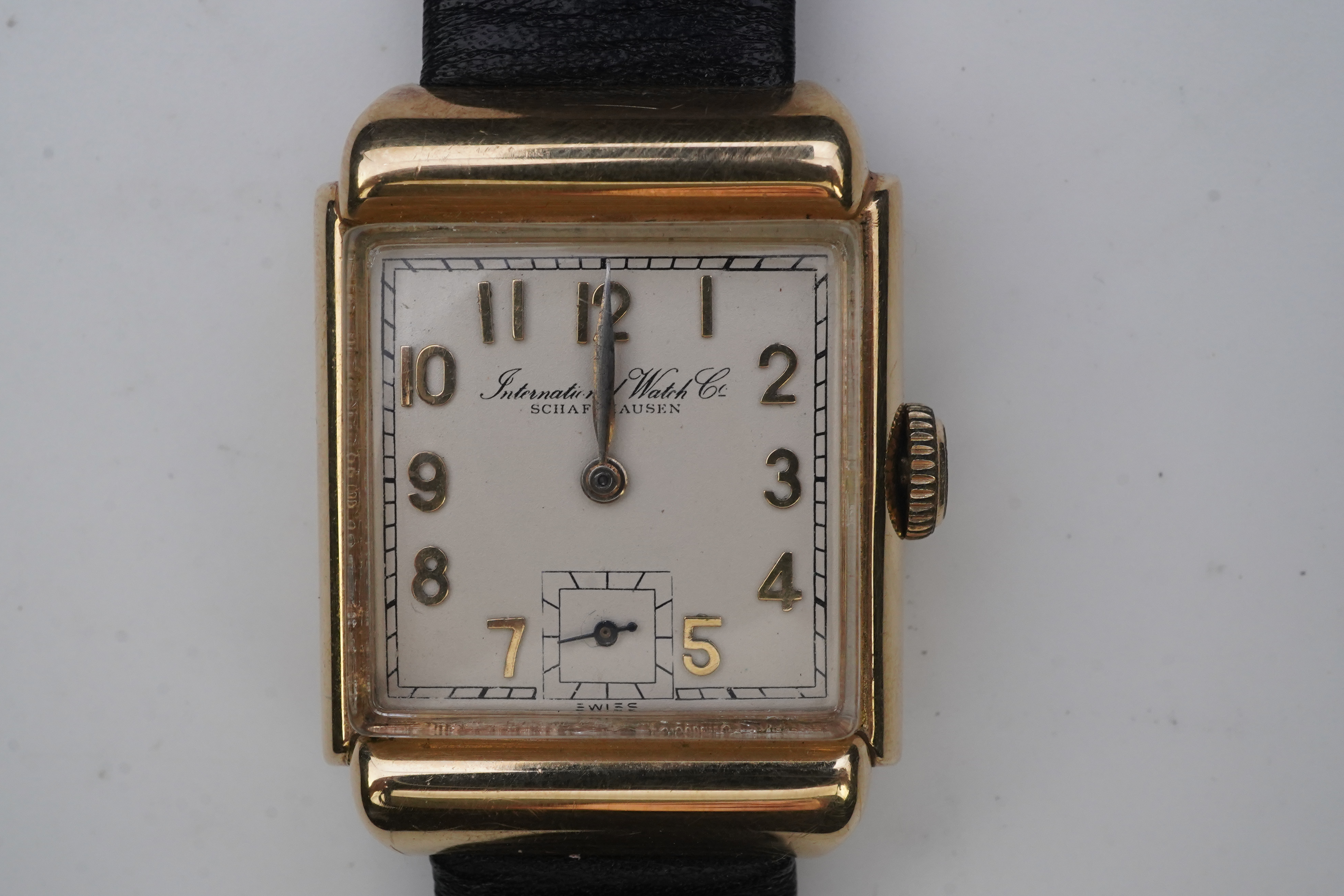 A gentleman's mid 20th century 14k gold International Watch Company manual wind wrist watch, on a later associated leather strap